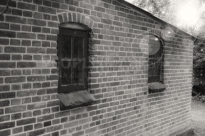 Buy stock photo Brick wall, black and white or window of home, house or city building with pattern and texture. Monochrome style, architecture exterior or traditional construction design on firm or old structure