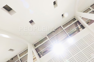 Buy stock photo Roof, window and architecture of airport, details and interior design of building, light and lens flare. Empty, room and mock up space of ceiling, travel and layout of structure, view and terminal