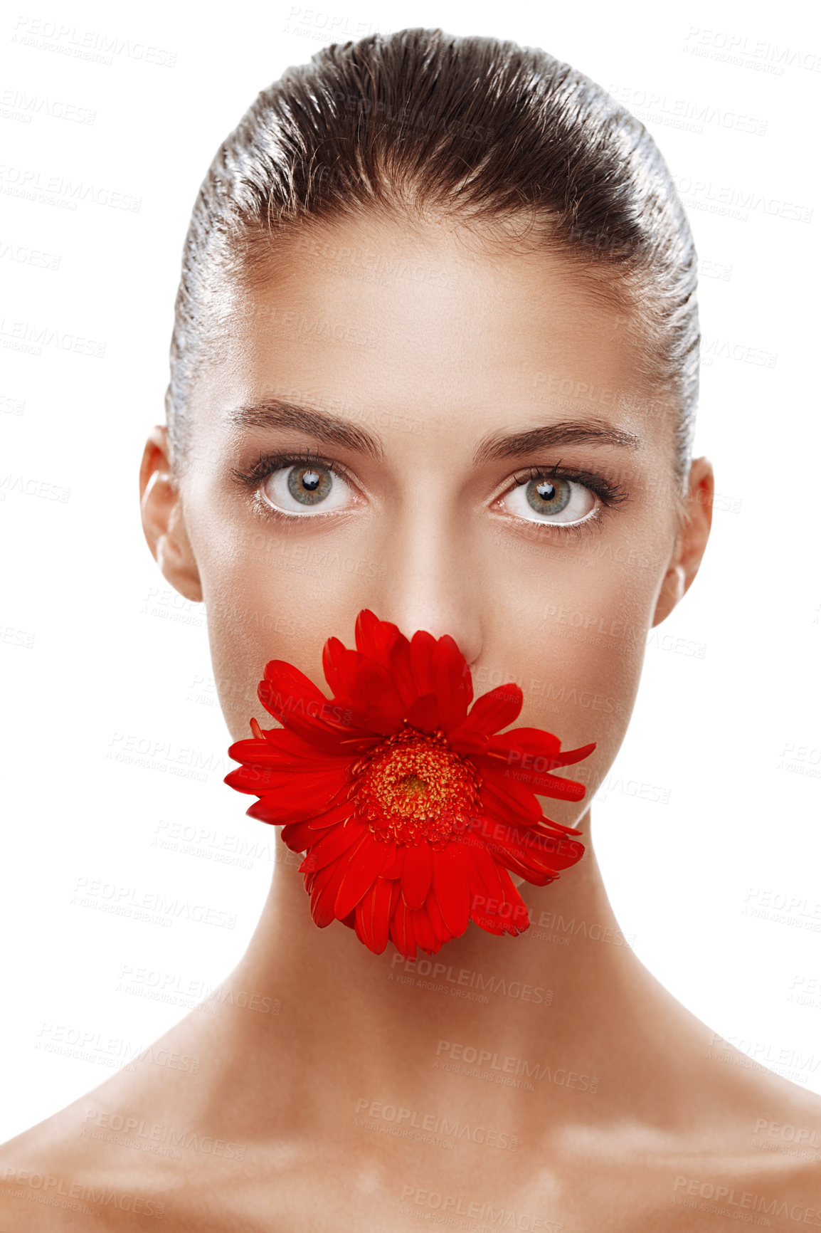 Buy stock photo Studio portrait of a beautiful woman with a flower in her mouth