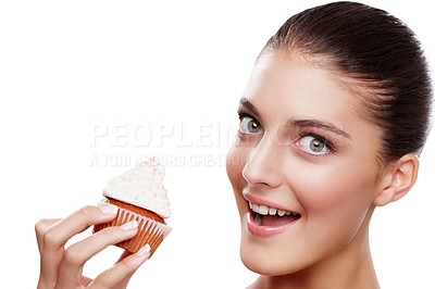 Buy stock photo Studio portrait of a beautiful woman holding up a cupcake