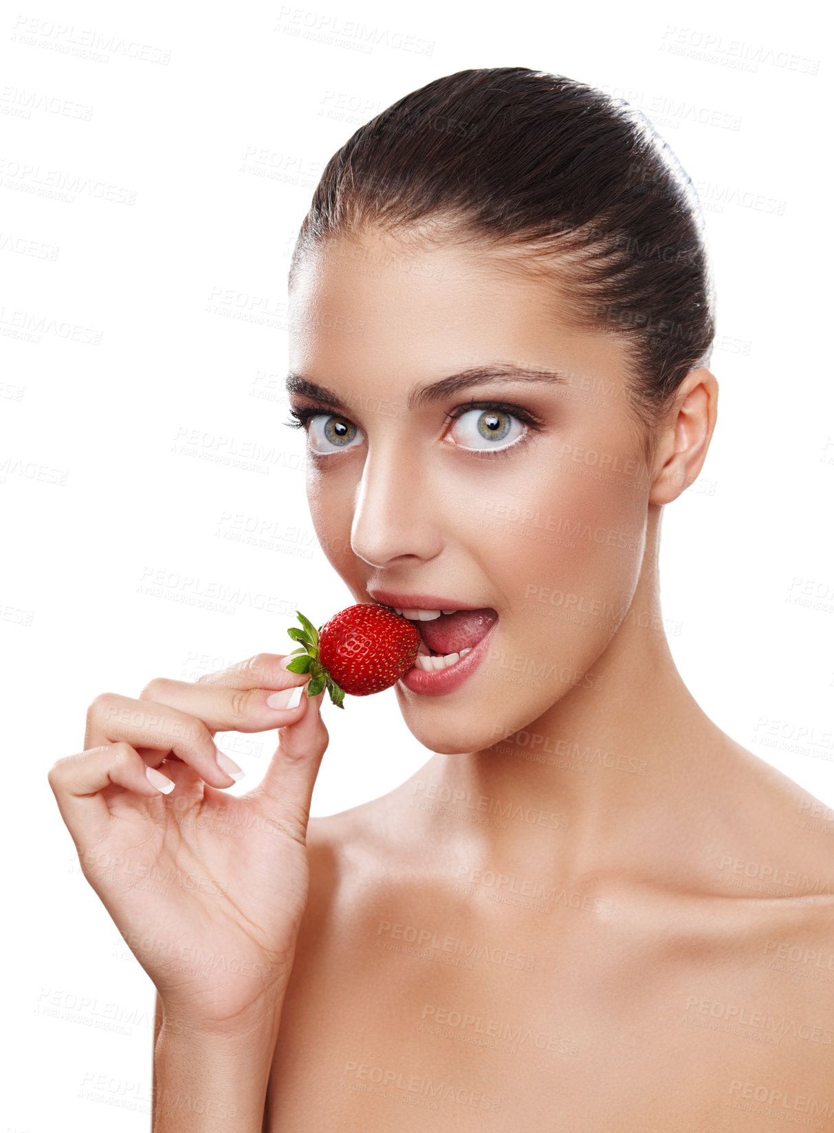 Buy stock photo Studio shot of a beautiful young woman eating a strawberry