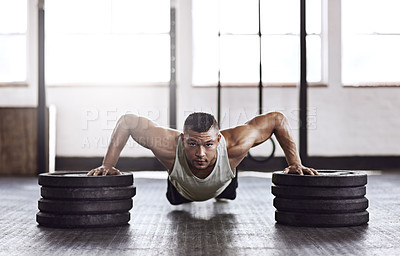 Buy stock photo Full length shot of a young man working out in the gym