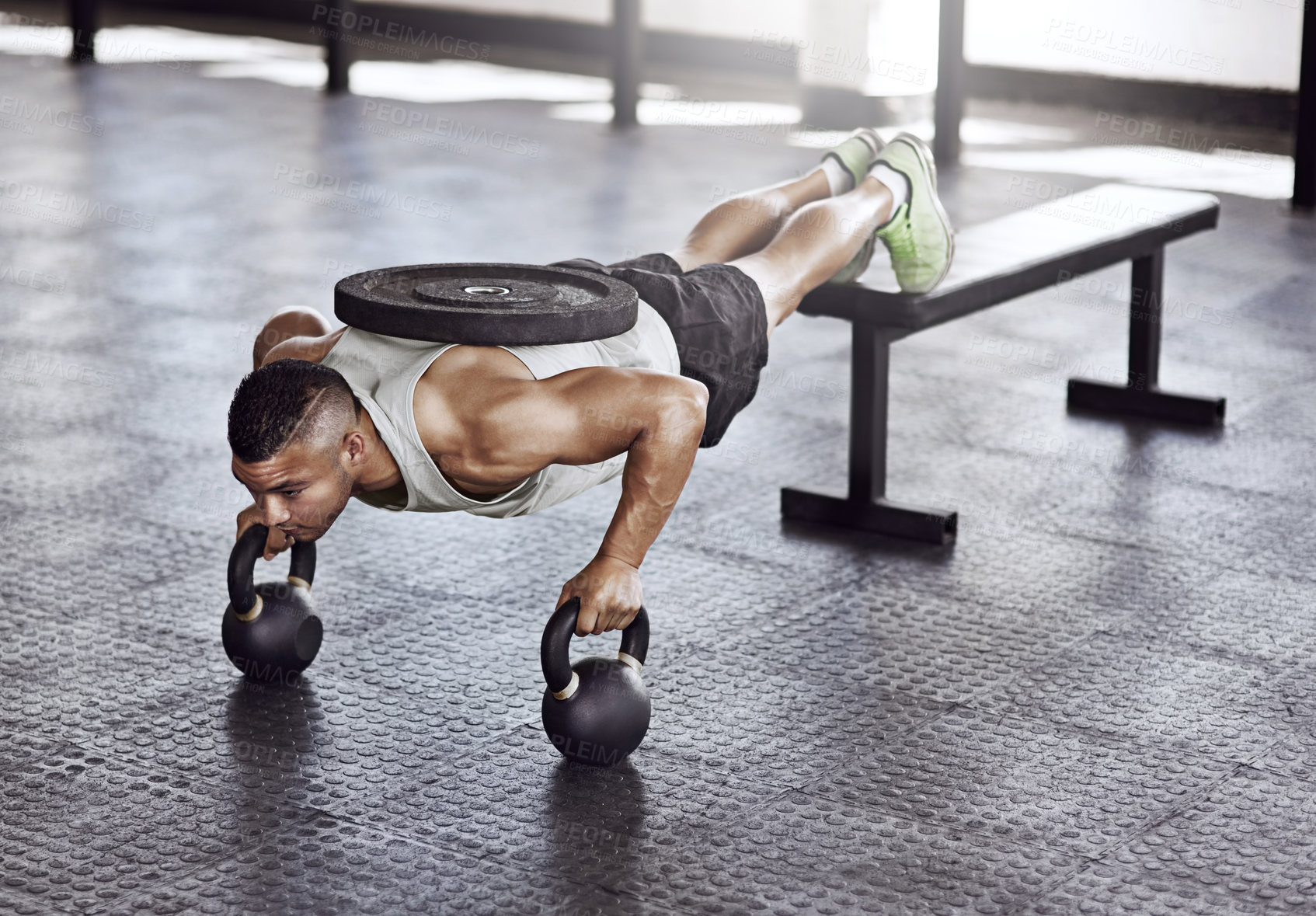 Buy stock photo Exercise, push ups and man in gym with kettlebell for strength training, endurance challenge or muscle growth. Power, athlete and person with weights for bodybuilding, performance workout or fitness