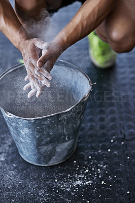 Buy stock photo Hands, powder and fitness for grip in gym, bucket and exercise in studio for weightlifting. Cross training, workout and sports for balance and chalk for athlete person, legs and bodybuilder or coach