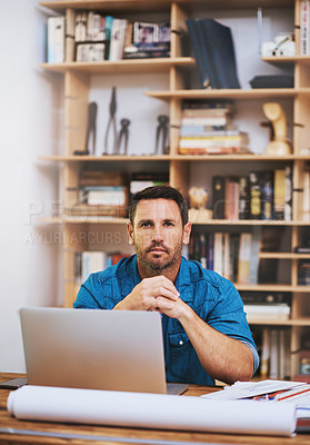 Buy stock photo Cropped portrait of a businessman working on his laptop at home