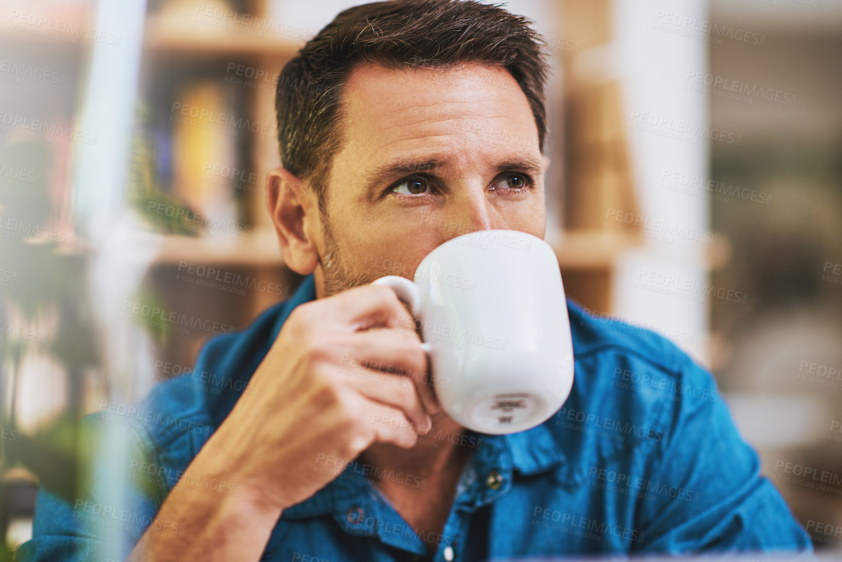 Buy stock photo Cropped shot of a businessman drinking coffee while working at home
