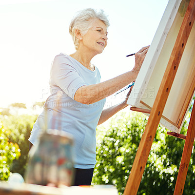 Buy stock photo Cropped shot of a senior woman painting in the park