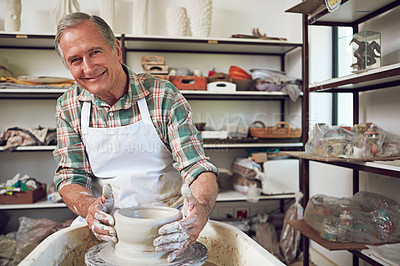 Buy stock photo Portrait of a senior man making a ceramic pot in a workshop