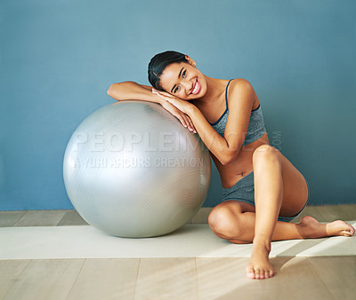 Buy stock photo Woman, portrait and exercise ball for yoga in home, fitness and floor to relax for wellness. Female person, pilates and gear for balance or core workout in studio, equipment and strength training