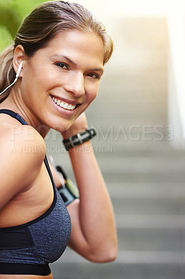 Buy stock photo Cropped portrait of an attractive young athlete exercising outdoors