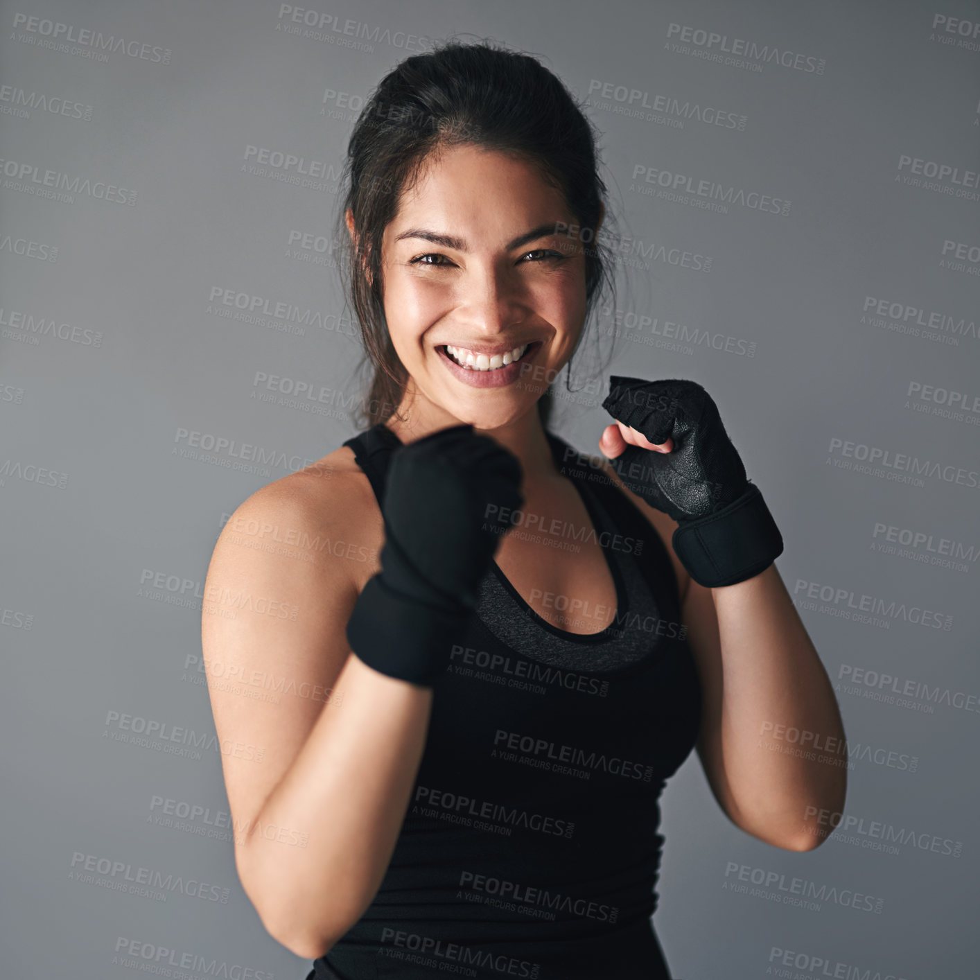 Buy stock photo Studio shot of a female kickboxer against a gray background