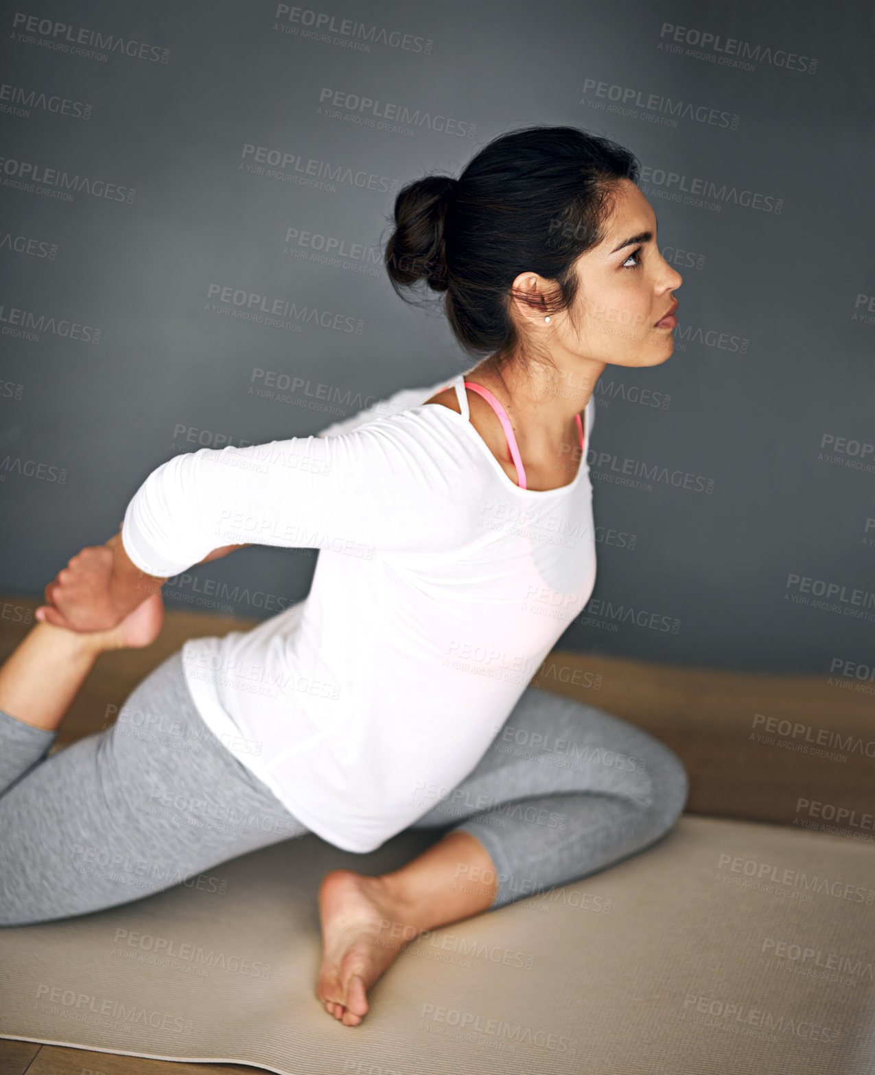 Buy stock photo Pilates, stretching and woman in home for balance, exercise or holistic training. Yoga, flexibility and female yogi warm up for wellness, fitness or health for muscle practice on gray wall background