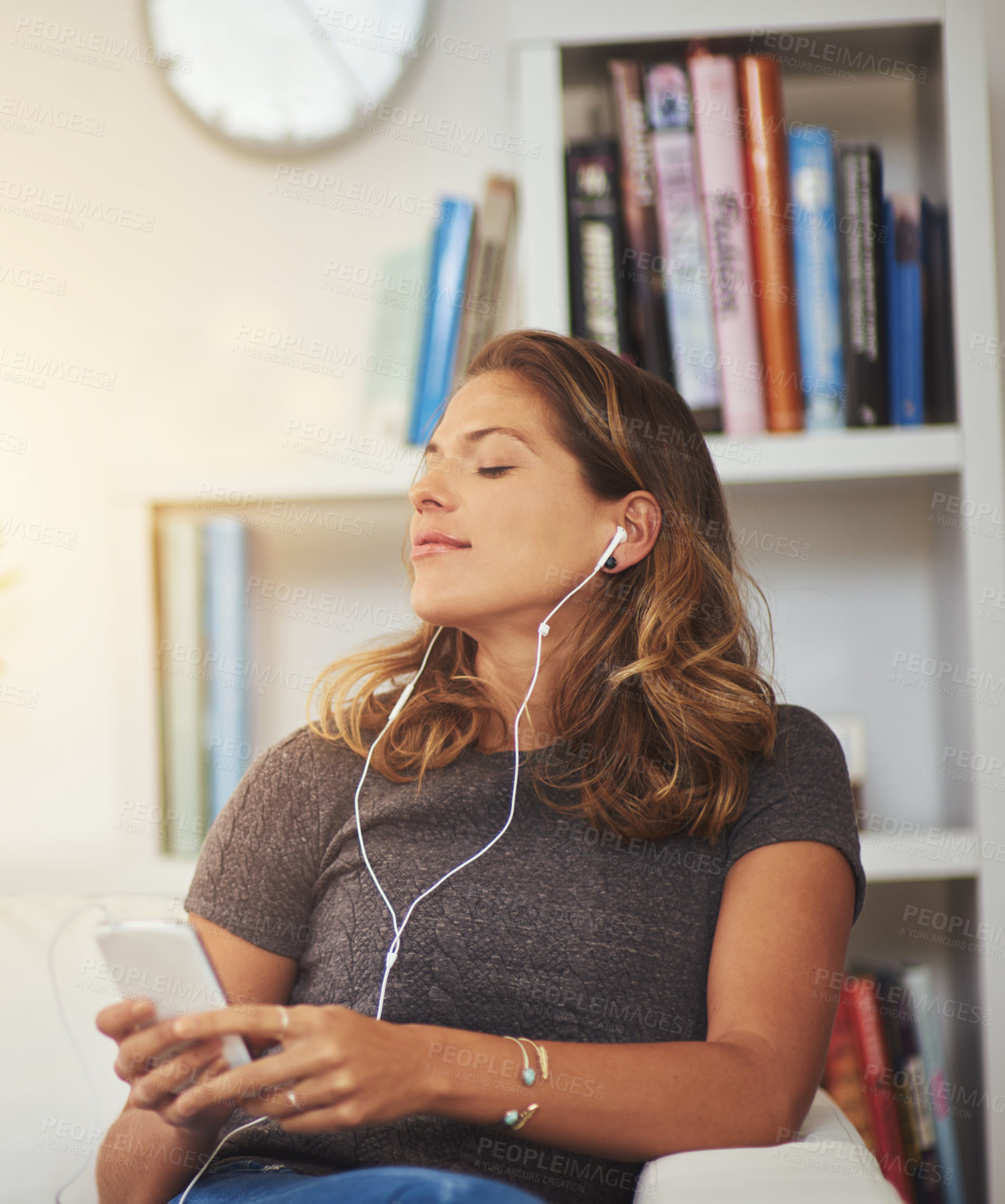 Buy stock photo Woman, earphones and music for peace on couch, communication and scroll on social media in home. Female person, phone and search movie platform for entertainment, ebook and app for sound or audio