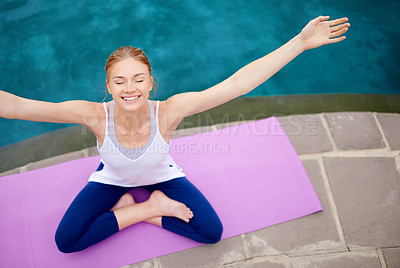 Buy stock photo Shot of a young woman doing yoga outdoors