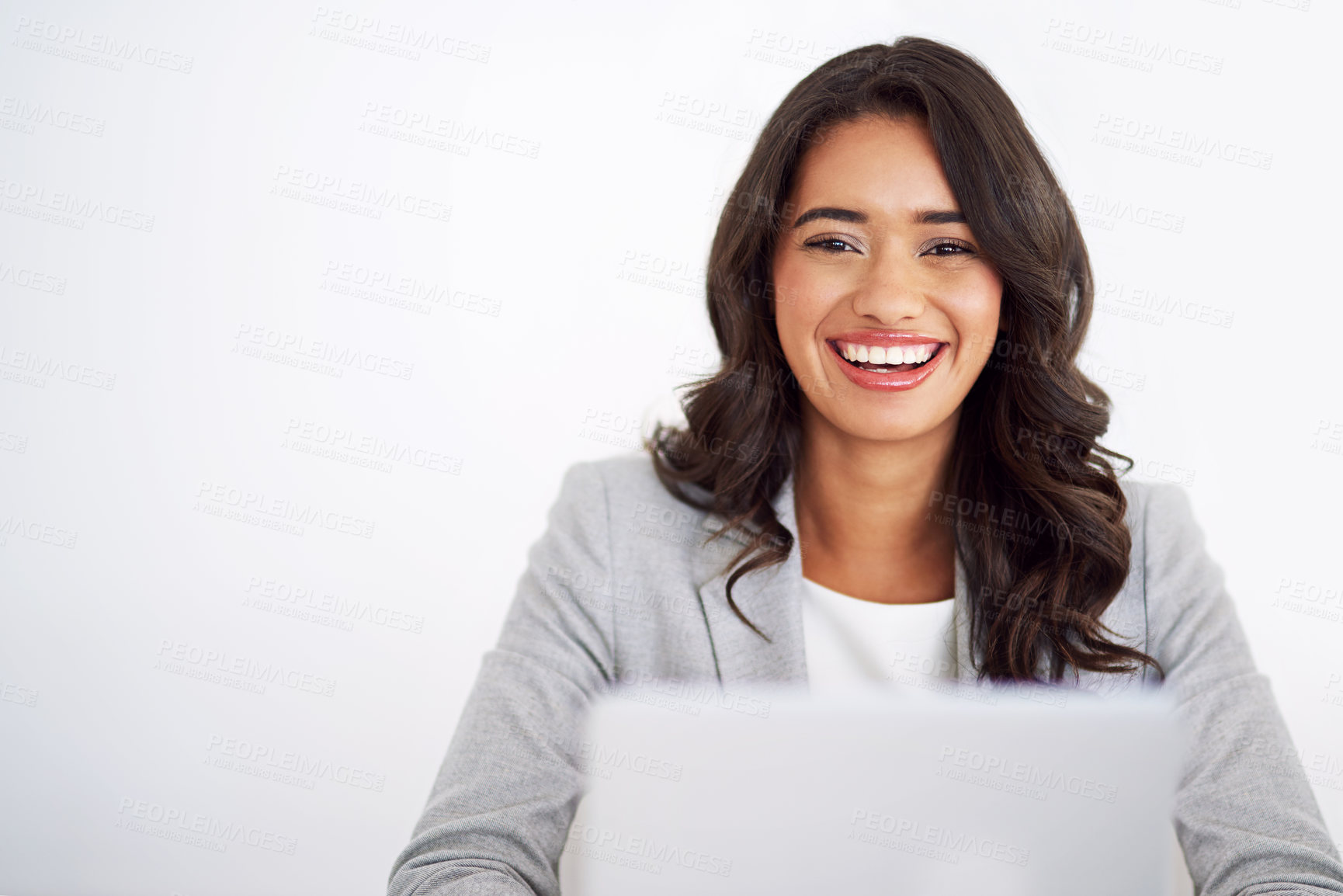 Buy stock photo Cropped portrait of a young businesswoman working on her laptop