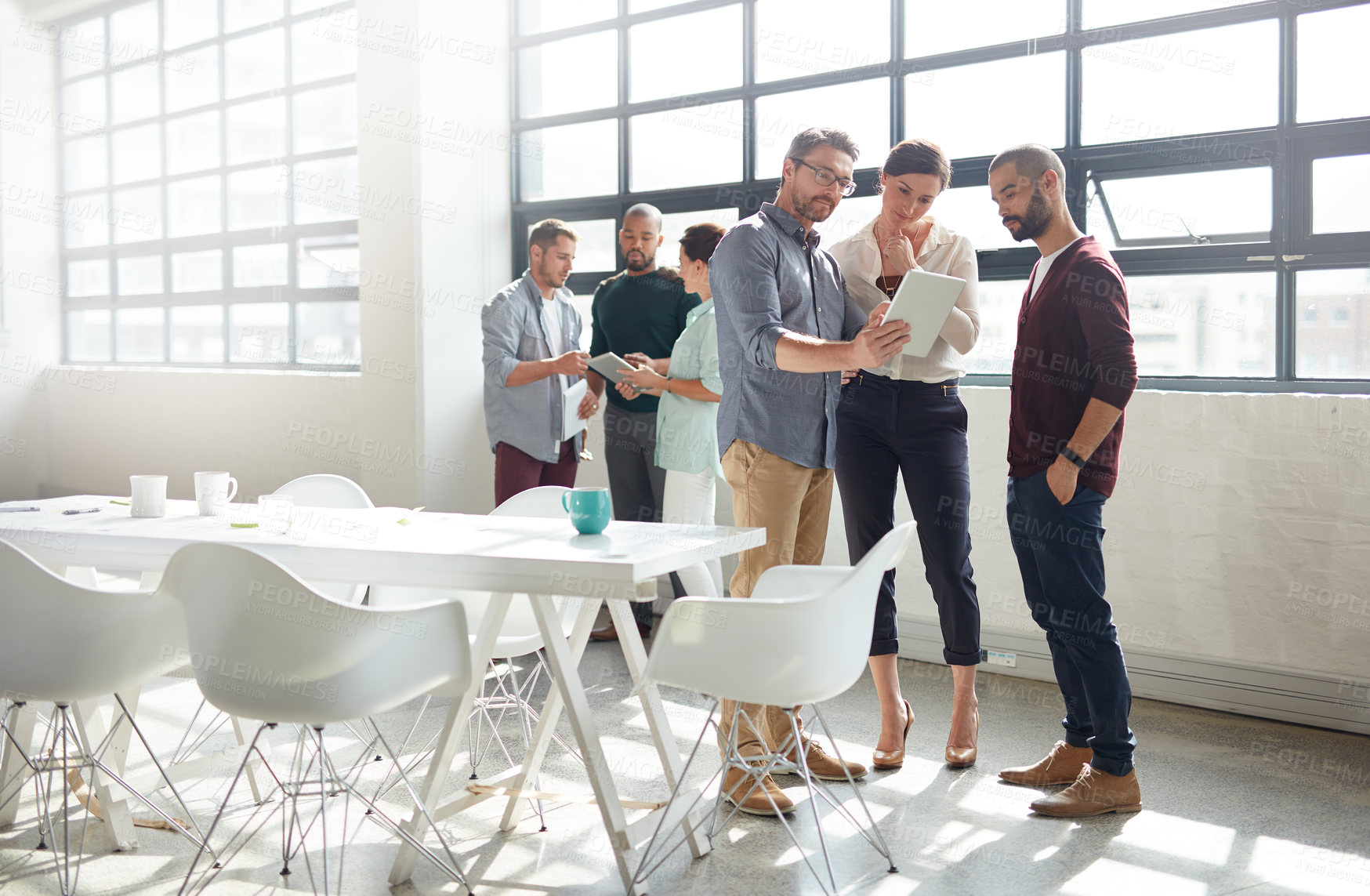 Buy stock photo Full length shot of a group of coworkers standing in the boardroom