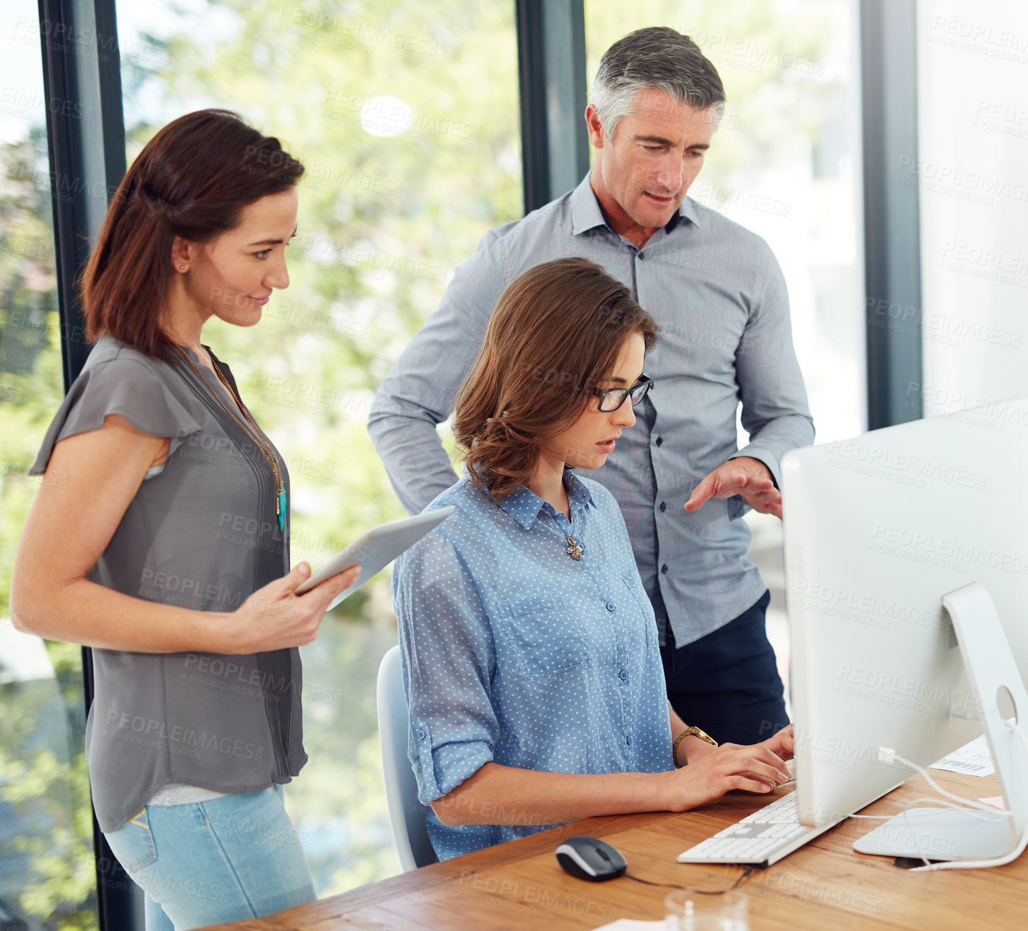 Buy stock photo Business people, computer and tablet for group in office for reading, typing or brainstorming at startup. Women, man and discussion for strategy, team and problem solving in scrum at creative agency