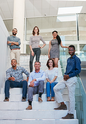 Buy stock photo Full length portrait of a group of businesspeople on the stairs of their office