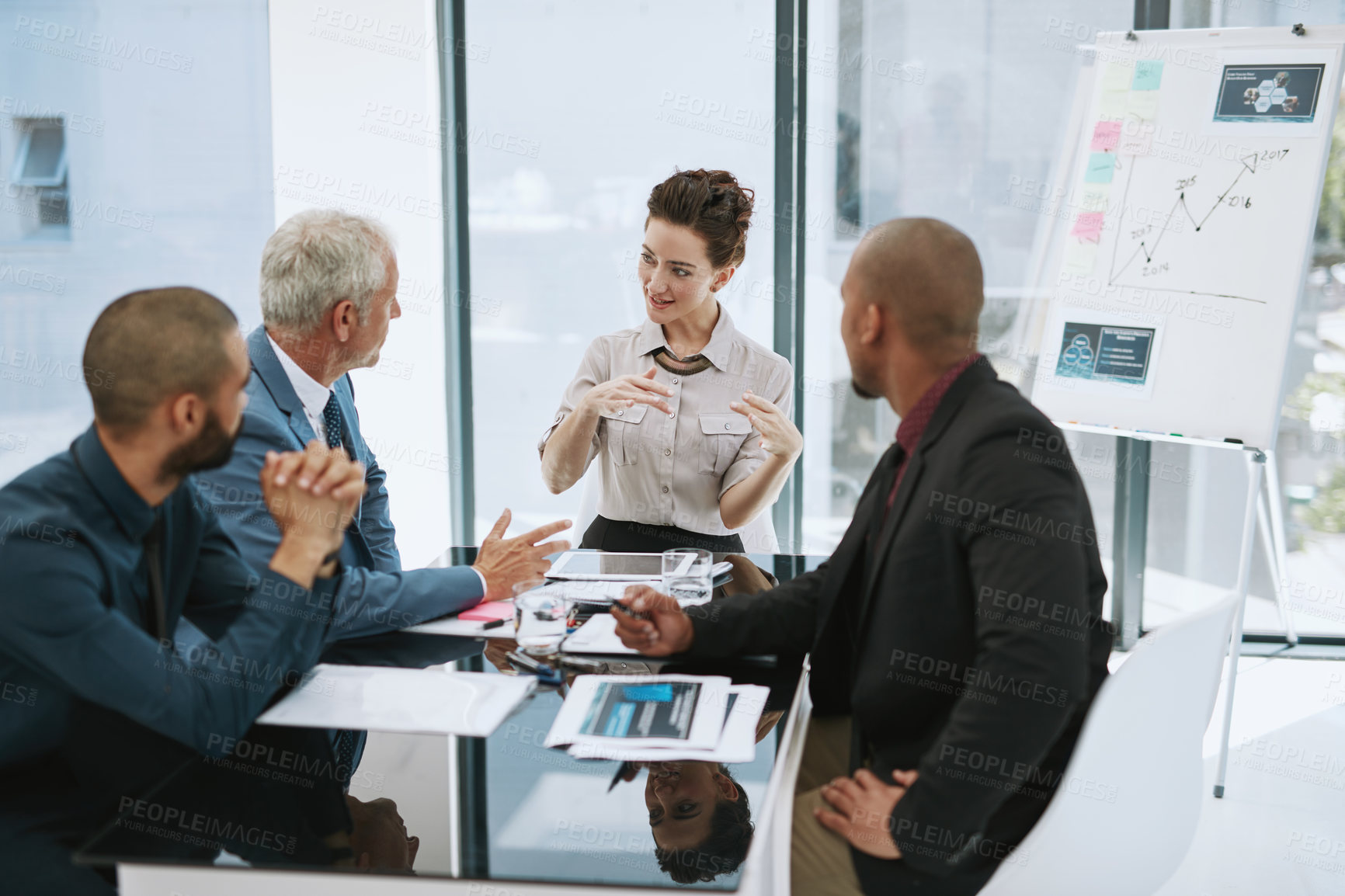 Buy stock photo Cropped shot of a group of businesspeople in the boardroom