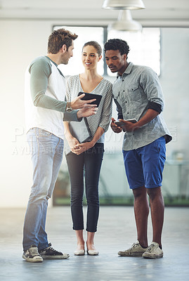 Buy stock photo Full length shot of three young designers talking in the office