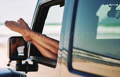 Buy stock photo Cropped shot of a young woman sitting with her feet up in her car
