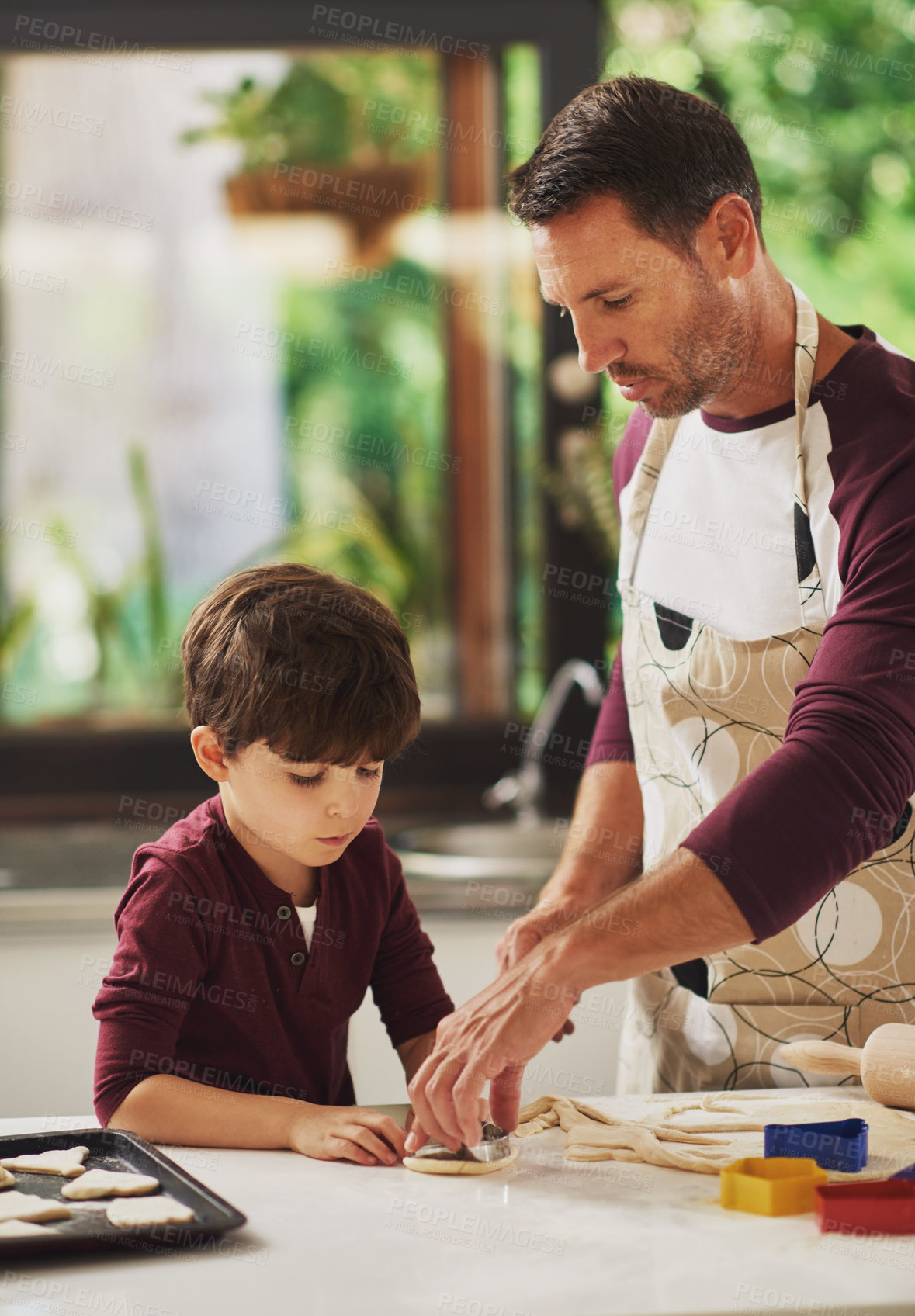 Buy stock photo Baking, dad and kid with cookies, teaching and support with rolling and chef costume together. Youth, family kitchen and food with ingredients for dessert with dough and bonding in home with love