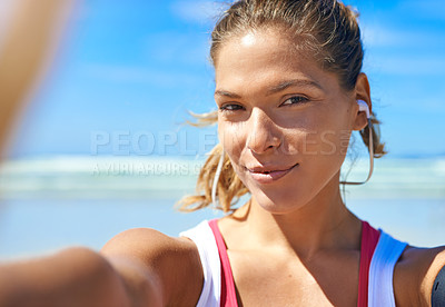 Buy stock photo Selfie, beach and fitness with a sports woman listening to music during her exercise workout outdoor in nature. Portrait, health and wellness with a female athlete training by the sea or ocean