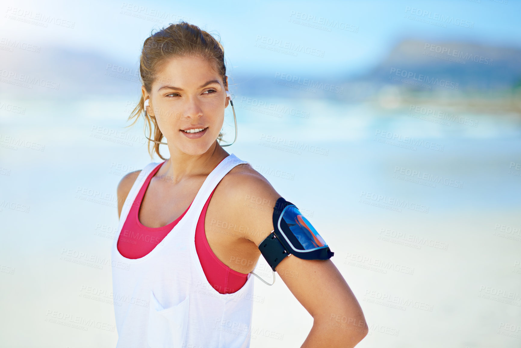 Buy stock photo Shot of a young woman working out on the beach