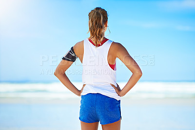 Buy stock photo Fitness, woman runner and relax on a break at the beach for exercise, workout or training in the outdoors. Active healthy female relaxing or breathing after running or exercising by the ocean coast