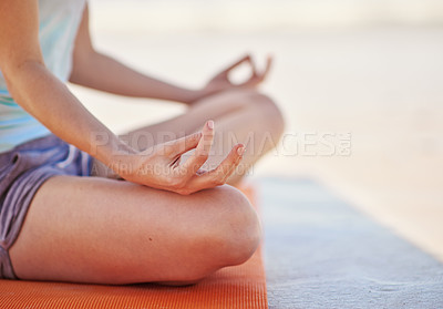 Buy stock photo Cropped shot of a woman practising the lotus position outdoors