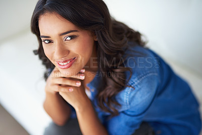 Buy stock photo Shot of a young woman relaxing at home on the weekend