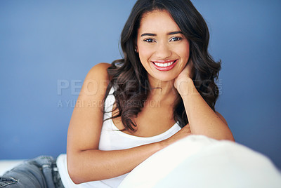 Buy stock photo Woman, relax and portrait smile on sofa in happiness or satisfaction for beauty cosmetics or treatment on mockup. Happy female model face smiling and relaxing on couch against blue studio background