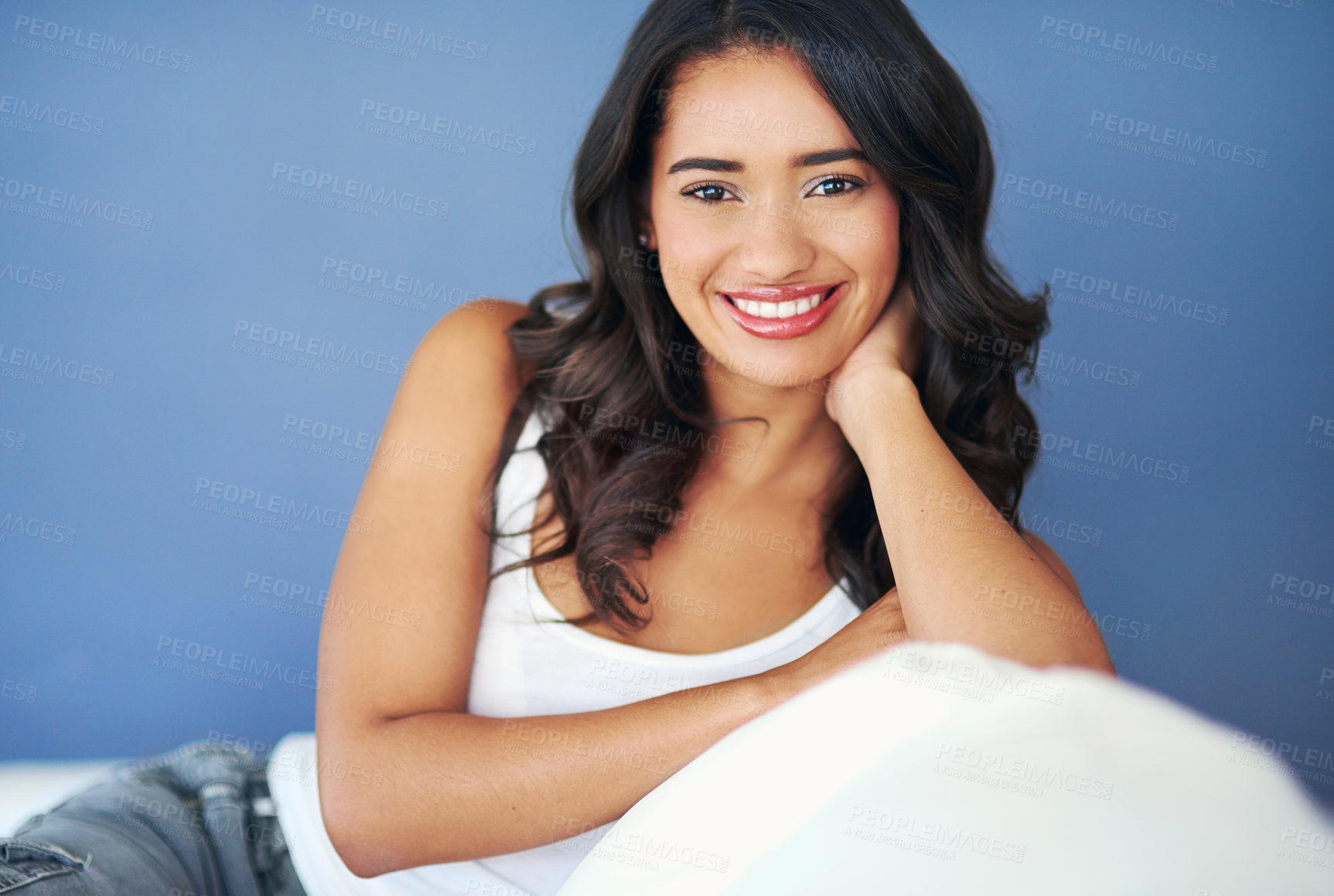 Buy stock photo Woman, relax and portrait smile on sofa in happiness or satisfaction for beauty cosmetics or treatment on mockup. Happy female model face smiling and relaxing on couch against blue studio background