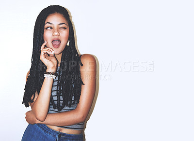 Buy stock photo Studio shot of an attractive young woman winking