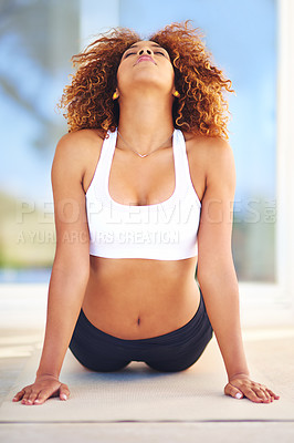 Buy stock photo Cobra, yoga and woman stretching for wellness, mindfulness and morning routine. Posture, flexibility and African person with balance, peace or holistic healing on mat to release tension or meditate