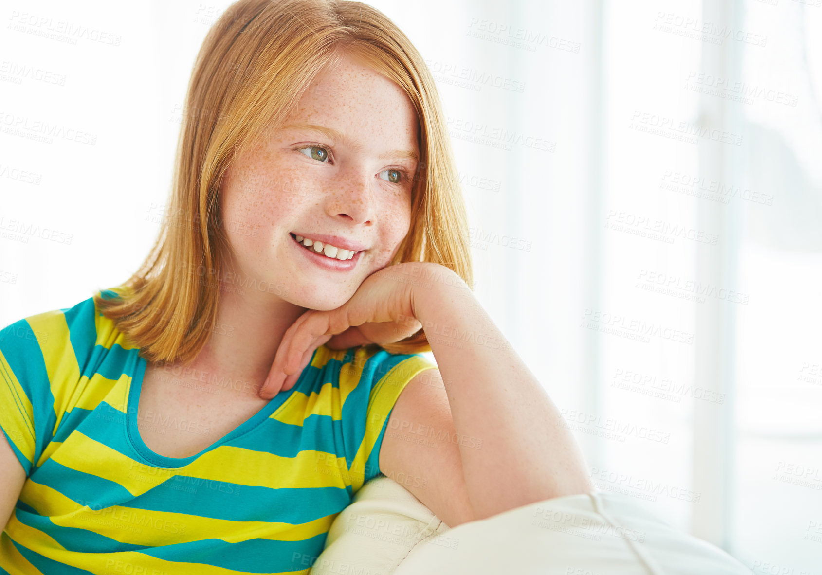 Buy stock photo Shot of a little girl relaxing on the sofa at home