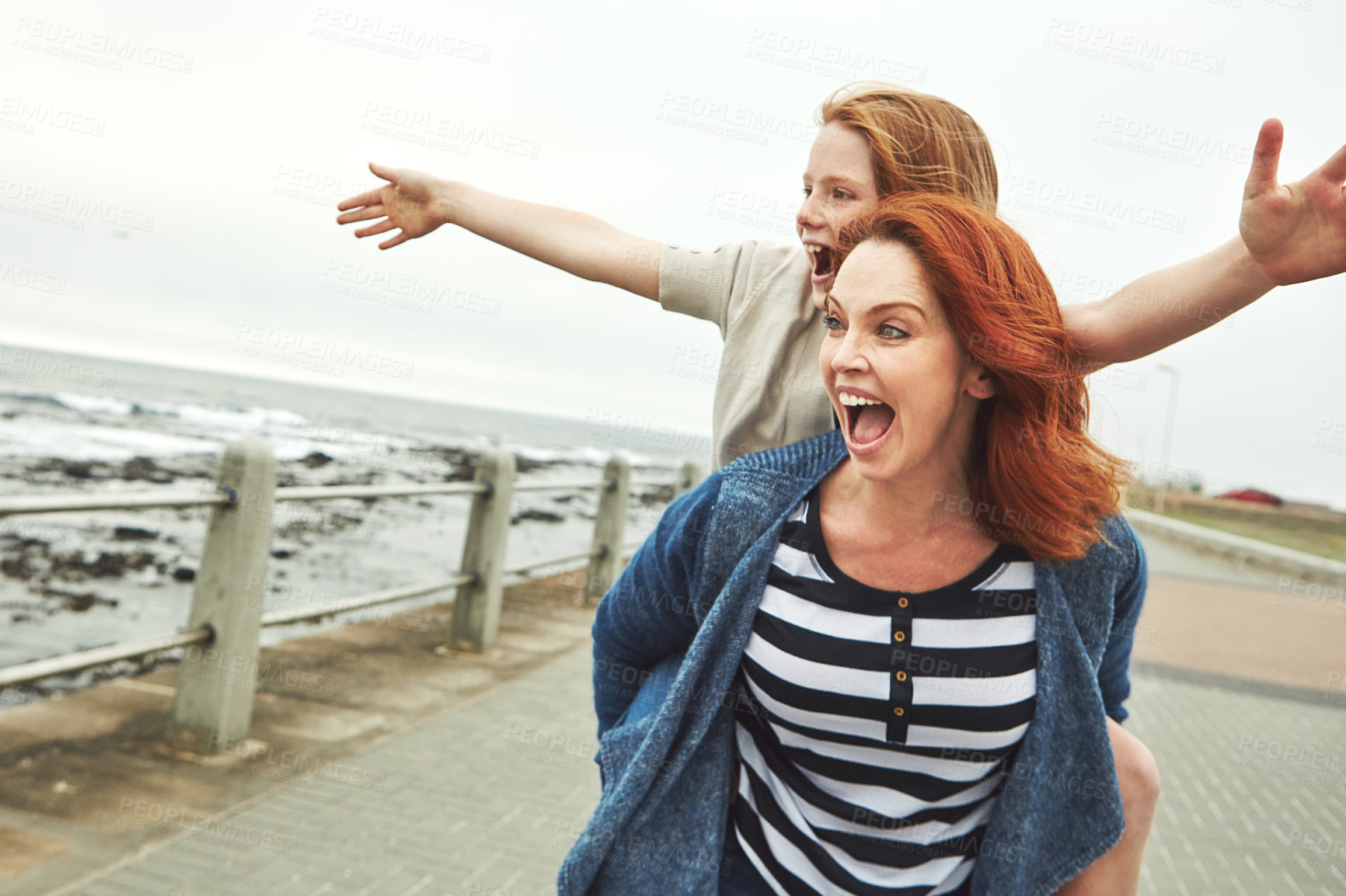 Buy stock photo Shot of a mother giving her daughter a piggyback ride