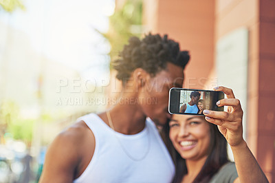 Buy stock photo Phone, happy or black couple with selfie kiss for love, happiness or bonding in city, street or town. Photo, smile or man and woman with 5g smartphone for social media, media app or blog upload