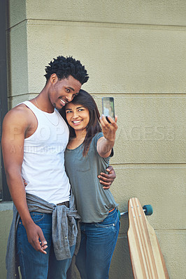 Buy stock photo Happy, interracial couple and picture with selfie in city for photography, memory or social media together. Man, woman or lovers with smile or hug for capture moment, love or support in an urban town