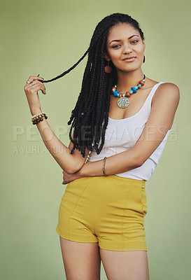 Buy stock photo Fashion, beauty and portrait of black woman on green background in studio with creative, exotic and designer jewellery. Summer, African style and happy girl with braids, cosmetics and trendy clothing