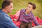 Having a father and son talk in the park