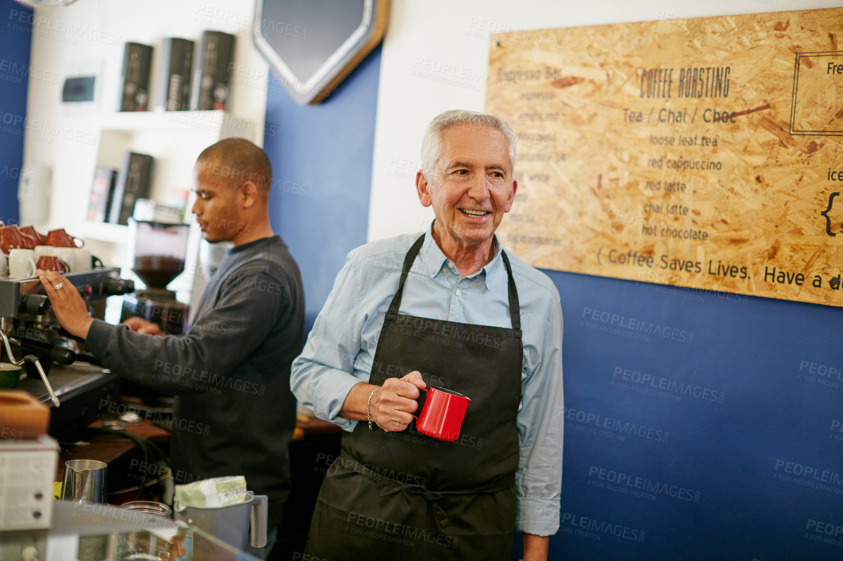 Buy stock photo Shot of a senior man working in a coffee shop