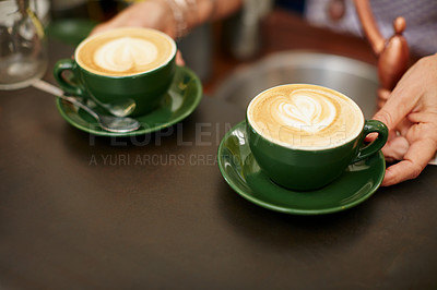 Buy stock photo Shot of creamy cappuccino in a coffee shop 