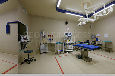 Buy stock photo Shot of monitoring equipment and a bed in an empty hospital ward