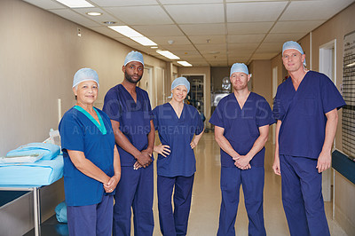 Buy stock photo Cropped portrait of a medical team standing in a hospital