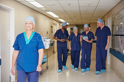 Buy stock photo Shot of a medical team standing in a hospital