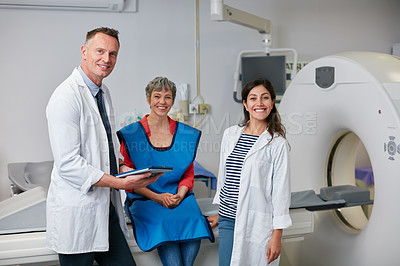 Buy stock photo Portrait of a mature woman and two doctors sitting by an MRI scanner