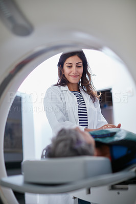 Buy stock photo Shot of a mature woman being comforted by a doctor before and MRI scan