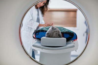 Buy stock photo Doctor, ct scan and woman comfort patient in hospital before scanning in machine. Mri, holding hands and medical professional with senior female person in radiology test for healthcare in clinic.