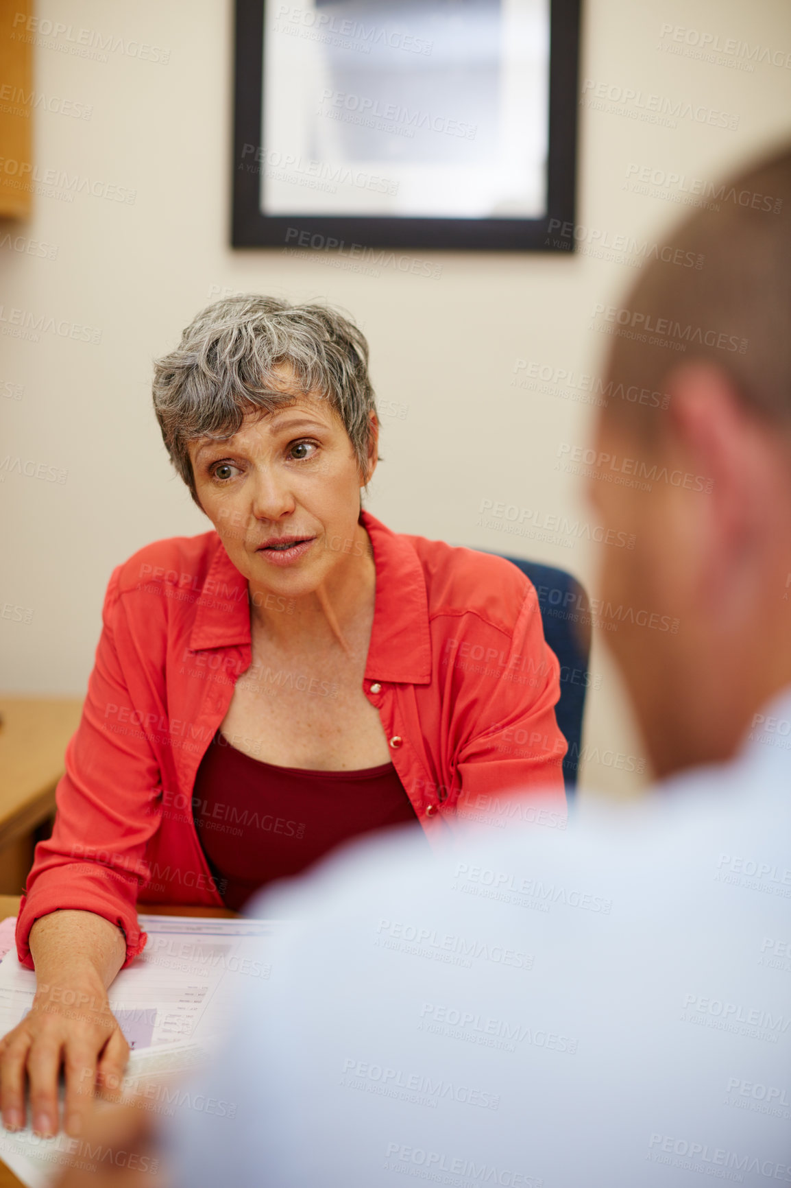 Buy stock photo Rearview shot of a man in a meeting with his financial advisor